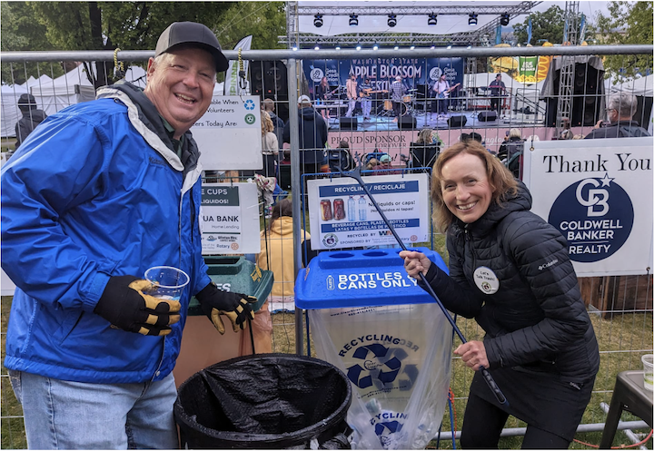 Alert at the Apple BlossomFestival Beer Garden, volunteers Brian
Brennan and Selina Danko fished out
items that needed to go to a different
receptacle.