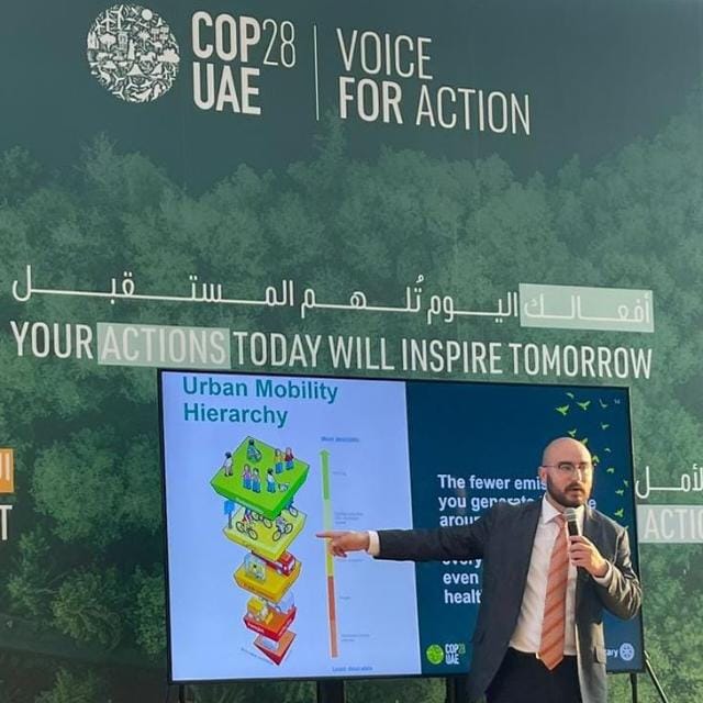 Person leading a presentation at COP28.