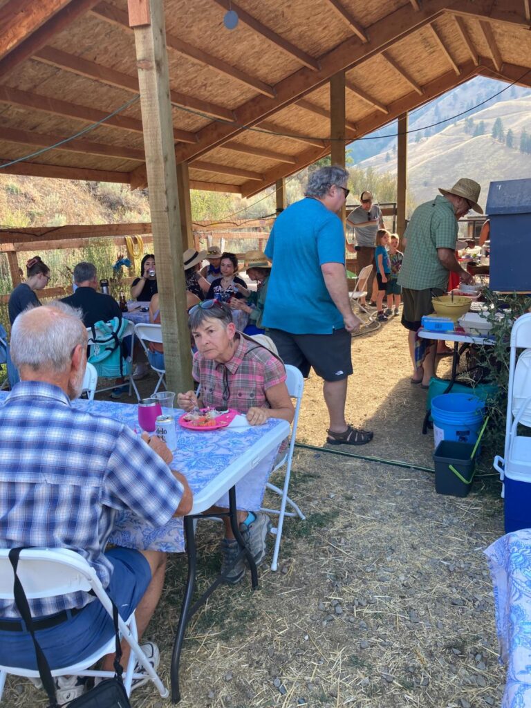 Rotarians enjoying plant based potluck