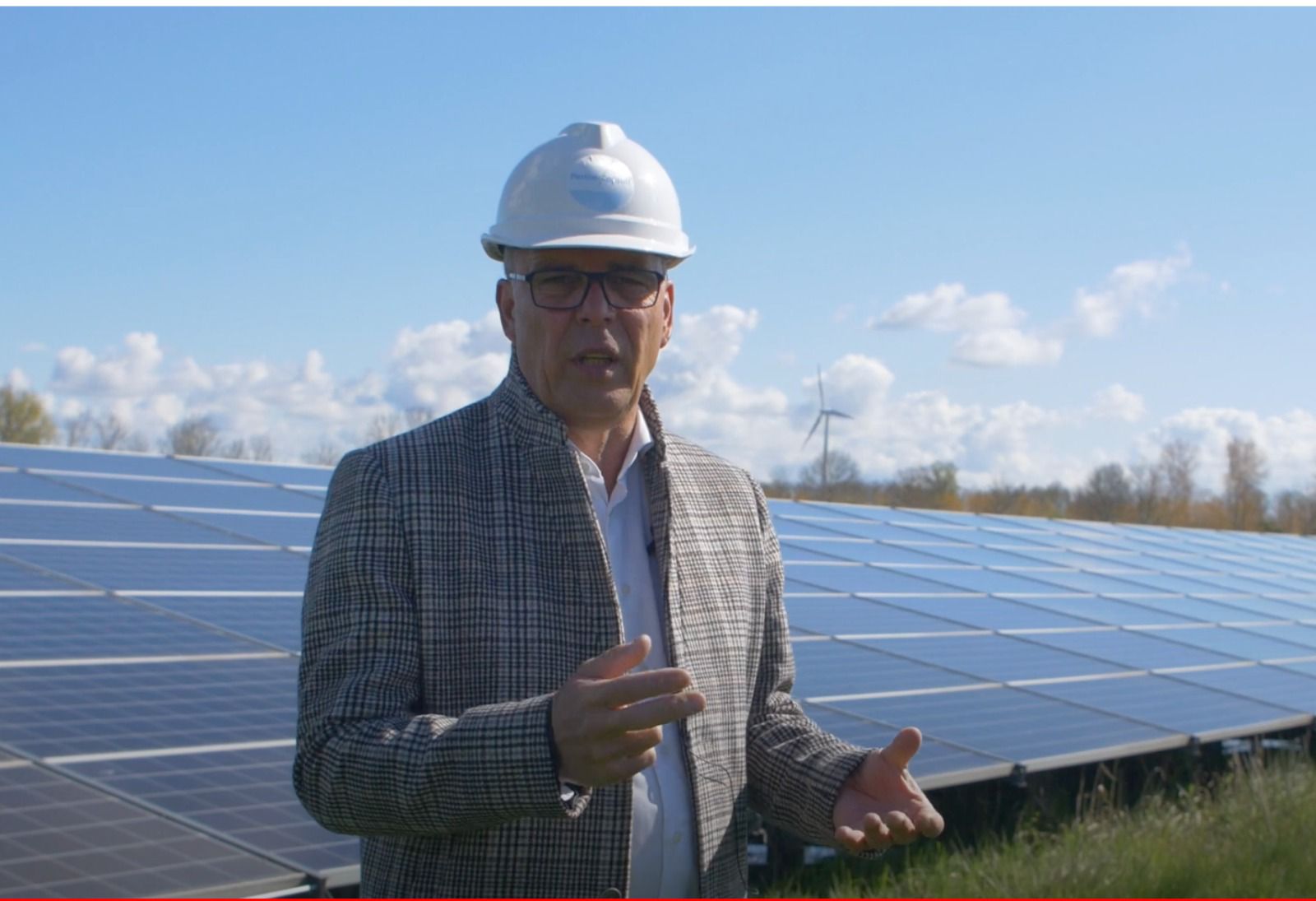 Geert Jan ith solar panel farm in Lelystad