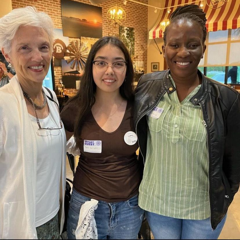 Rotarian Pat Strong, Interactor Sophia Elise Henriquez, and ESRAG Director Cinderella Ndvolu at the D 6960 District Conference